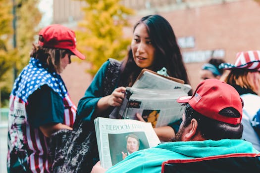 A group of adults reading newspapers outdoors, immersed in political discussions on a vibrant day.